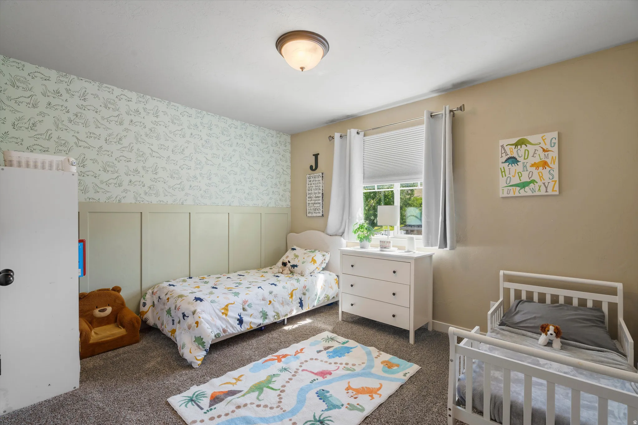 Panel accent wall with patterned wallpaper