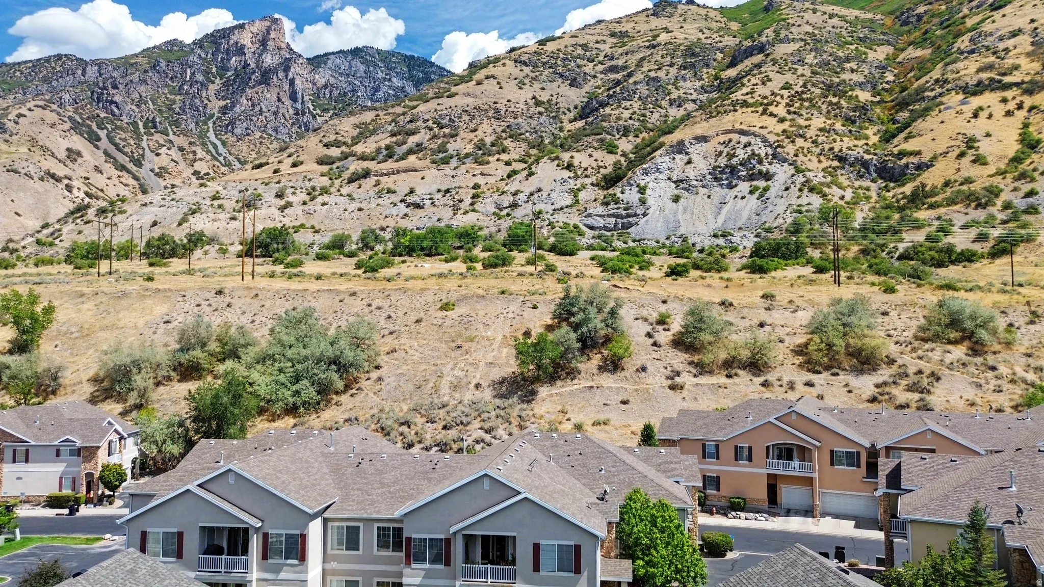 Mountain backdrop with varied terrain and natural vegetation