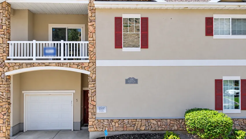 Front view of the balcony and garage.