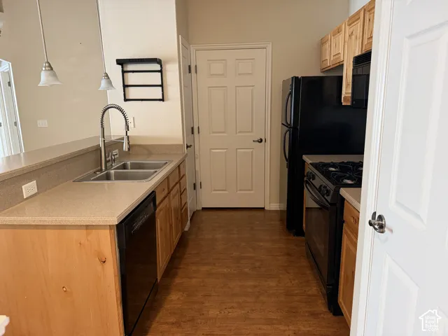 Kitchen complete with included black appliances and open to the family room.