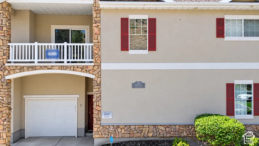 Front view of the balcony and garage.