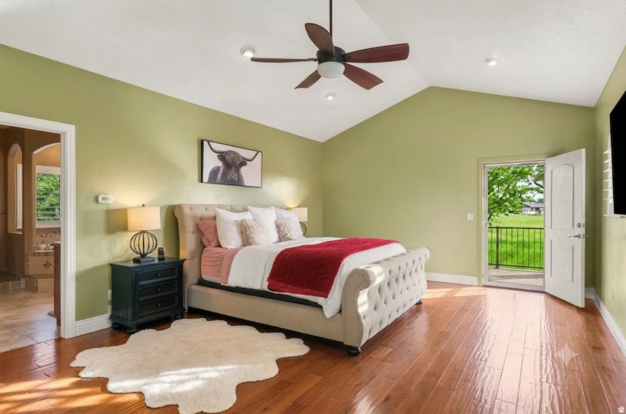 Hardwood flooring, vaulted ceilings, ceiling fan, recessed lighting, and direct exterior access