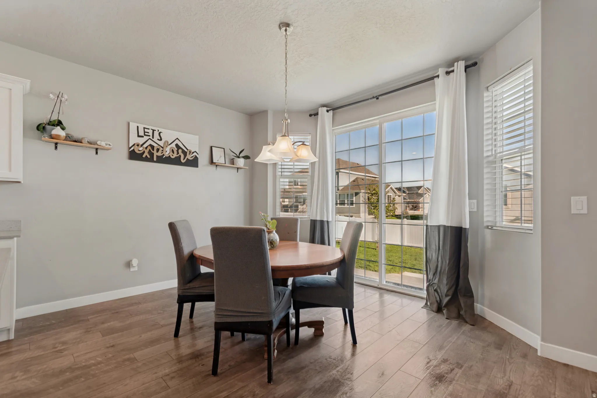 Wood-finish flooring with a neutral wall color, providing a consistent aesthetic
