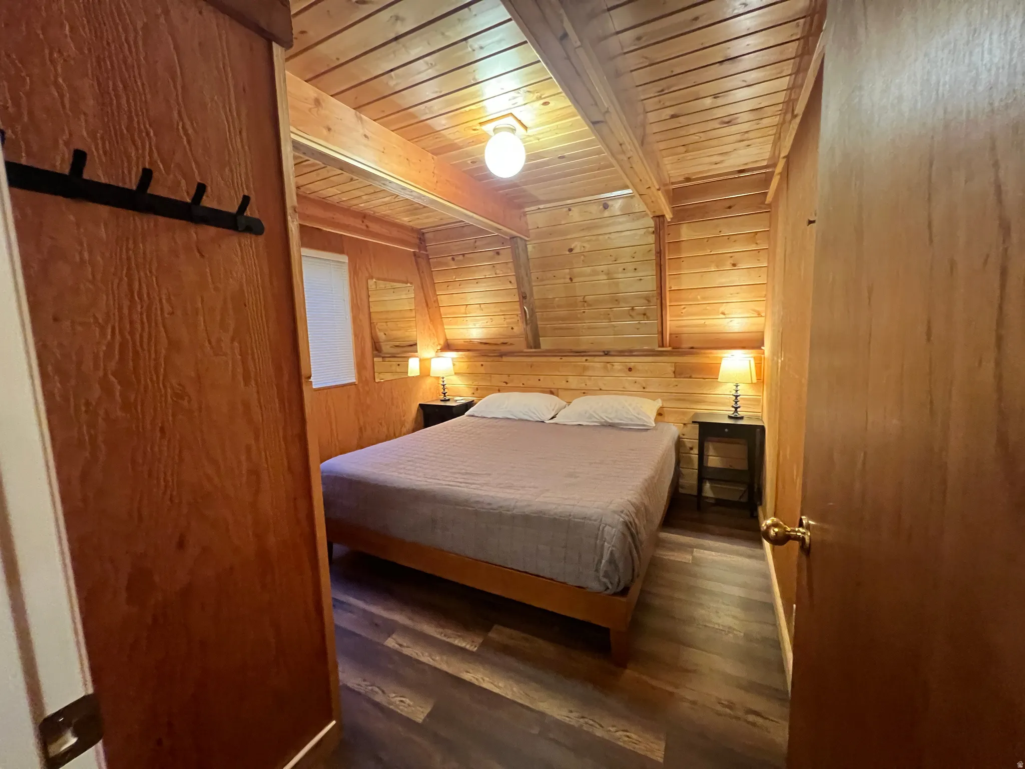 Main floor bedroom invites with cedar pannels and promised warmth.