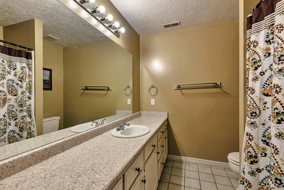 Vanity with an integrated sink, extended countertop, and cabinetry