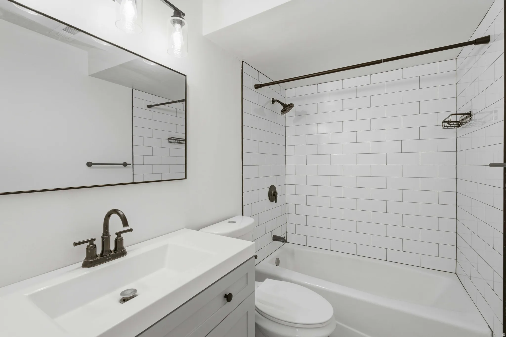 White subway tile tub surround