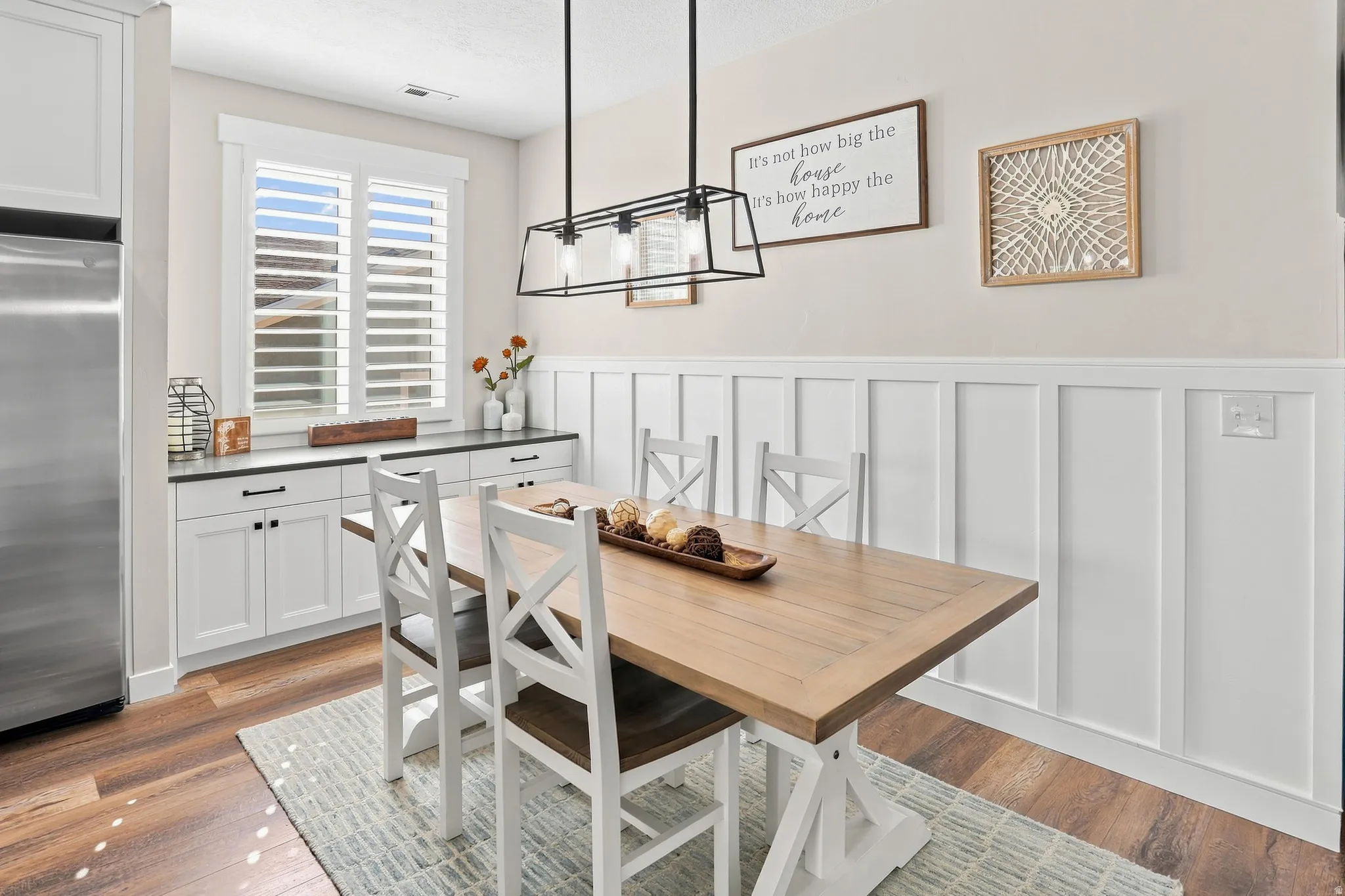 Wood-finish flooring with white board and batten wall paneling