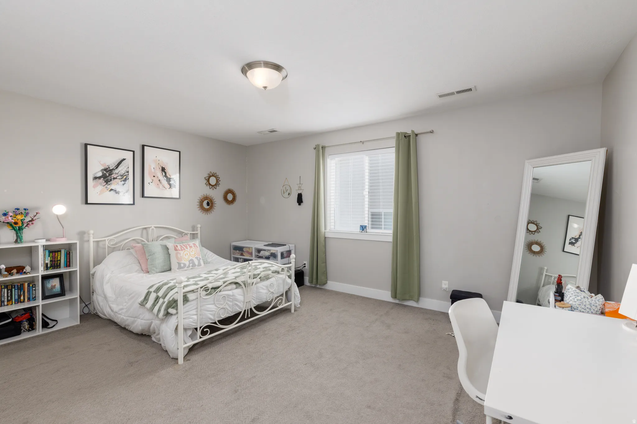 Wall-to-wall carpeting and a ceiling-mounted light fixture