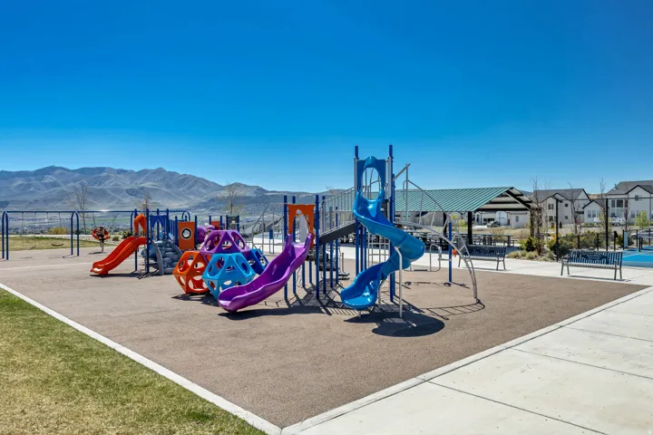 Playground with multiple slides, swings, and climbing structures