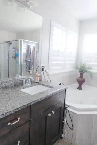 Dark wood-finish vanity with a built-in sink and polished chrome faucet