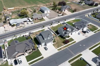 Two-story residence featuring a gabled roof and attached two-car garage