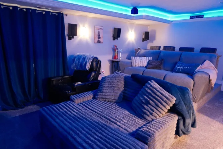 Recessed lighting, wall sconces, integrated sound system, crown molding, and carpet flooring