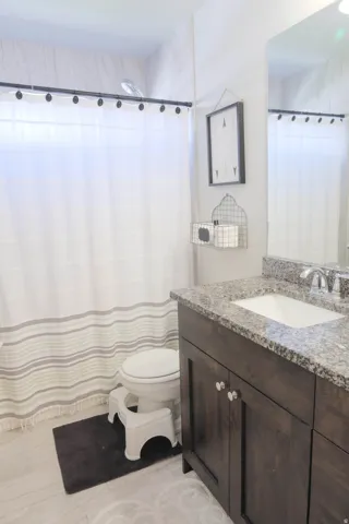 Bathroom with wood-finish flooring