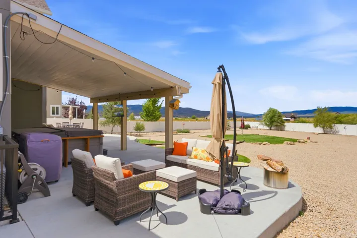 Covered patio with integrated lighting and concrete flooring