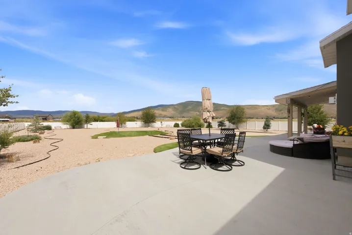 Expansive concrete patio with covered outdoor living space