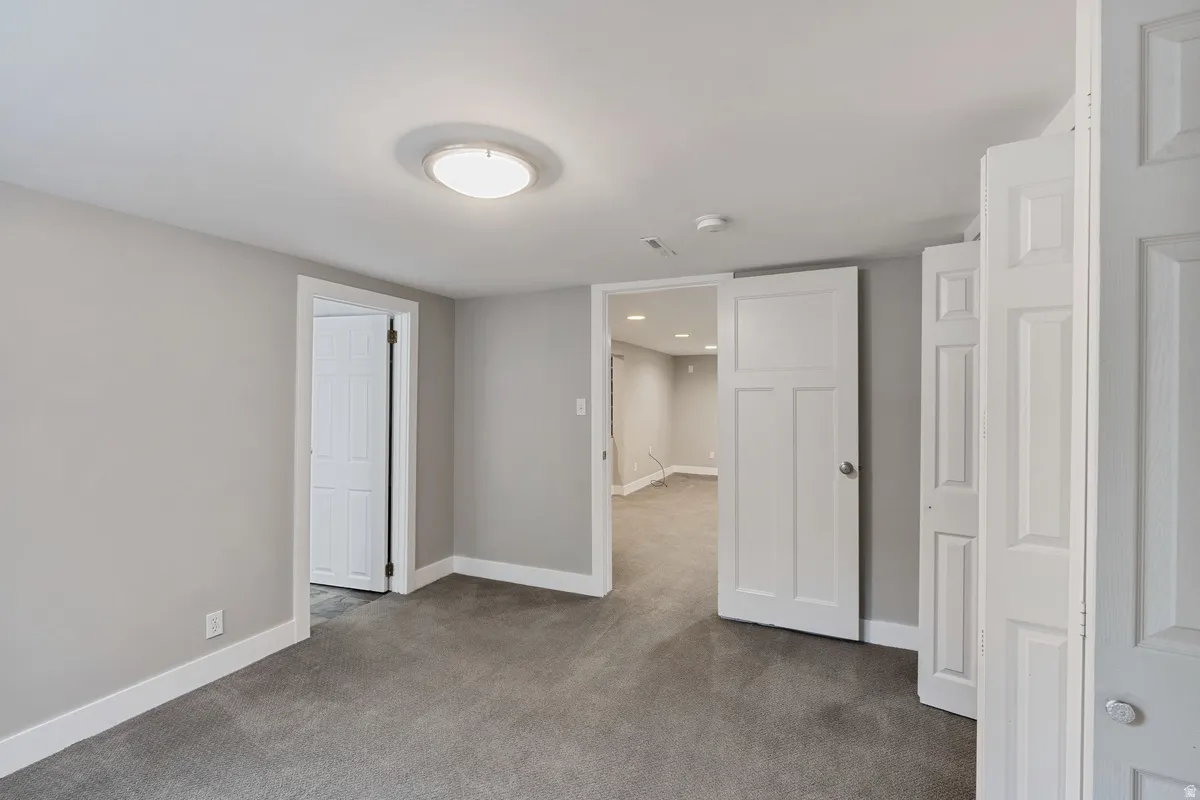Neutral gray wall paint and plush carpeting