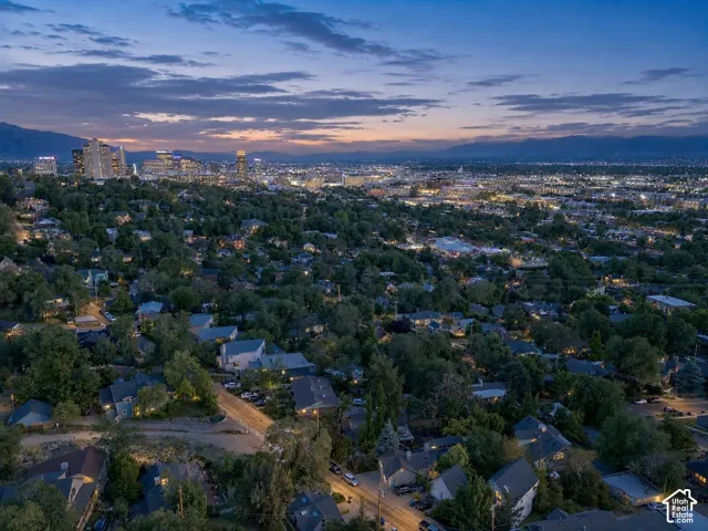 Expansive residential area featuring numerous single-family homes nestled among mature trees