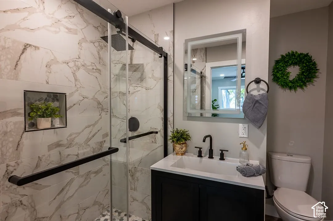 Walk-in shower with stone-look tile walls and a built-in niche