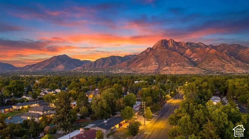 Mountain backdrop with extensive treed areas and residential properties