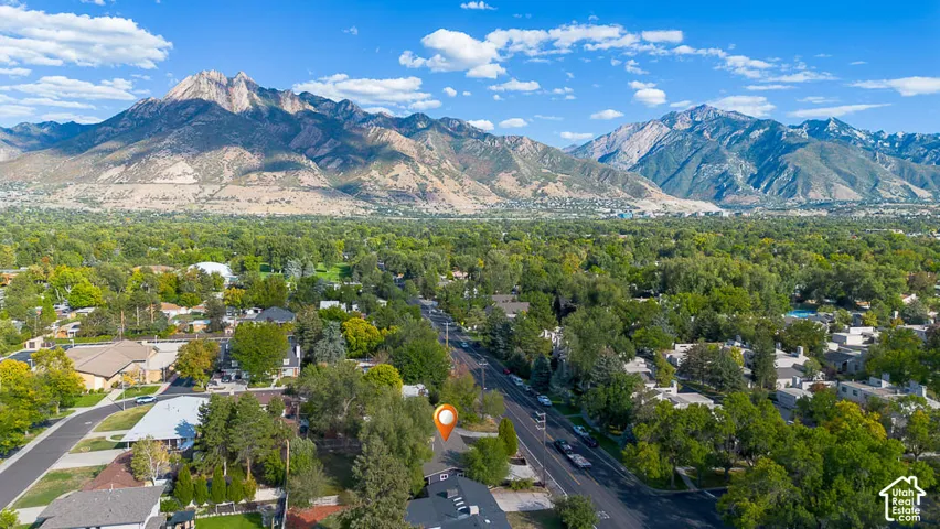 Expansive mountain range backdrop and lush green surroundings