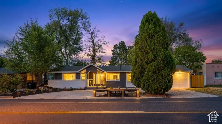 Modern exterior design with a contrasting façade, a covered front entry, and a single-car garage