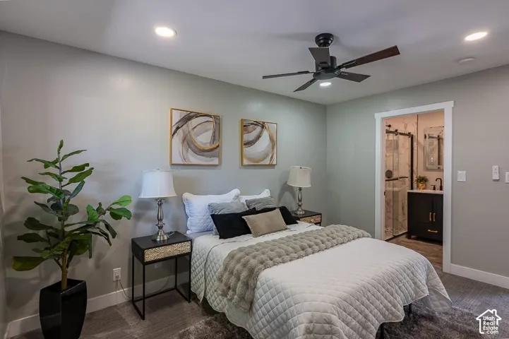 Recessed lighting, wood-finish ceiling fan, and carpeted flooring