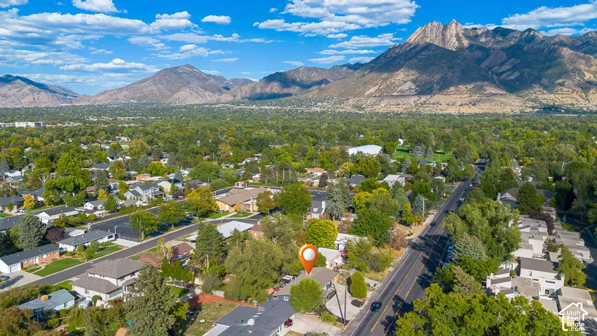Mountain backdrop and expansive tree-lined neighborhood