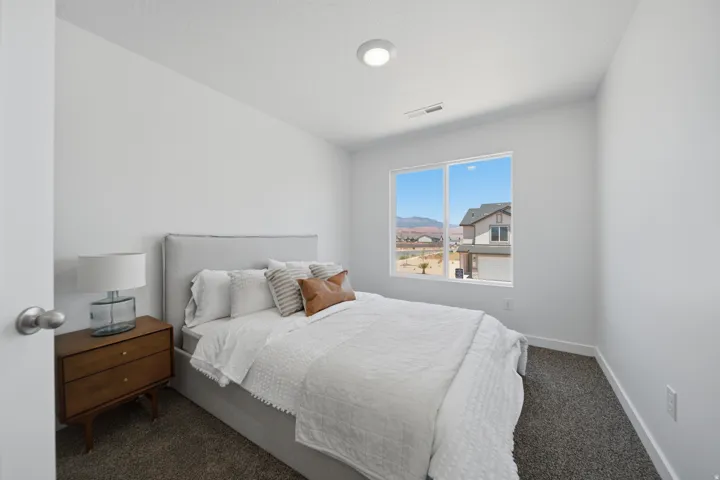 White walls, recessed ceiling light, large window, and carpeted flooring