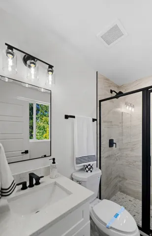 Vanity with integrated sink and matte black faucet
