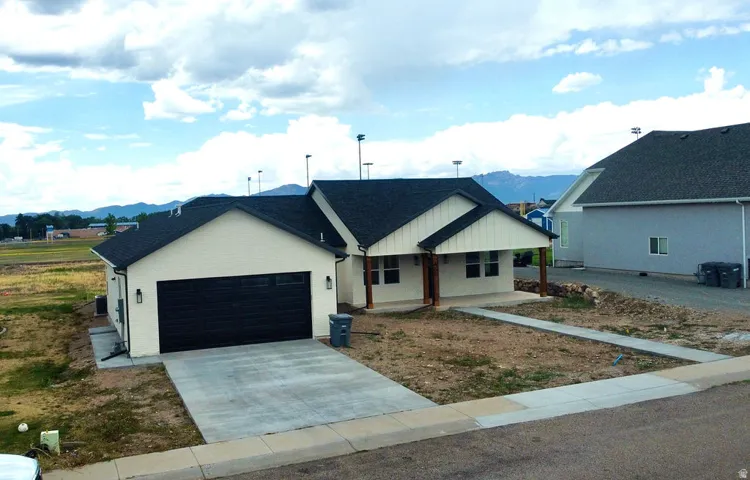 Single-level residence with an attached garage and concrete driveway