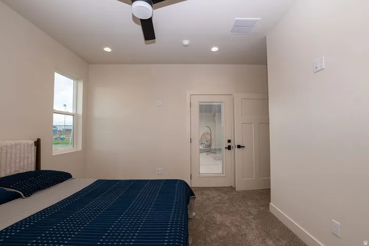 Recessed lighting, ceiling fan, white trim, single-hung window, and neutral wall paint