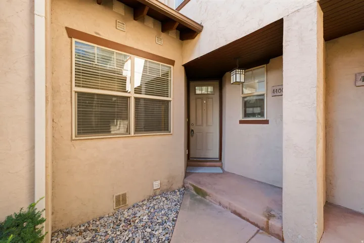 Stucco exterior with wood trim accents