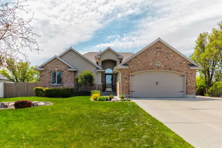 Brick and stucco exterior with an arched entryway