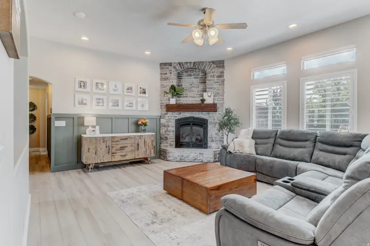 Stone fireplace with a substantial wood mantel