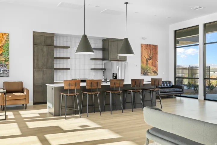 Spacious interior featuring wood-finish flooring and large windows