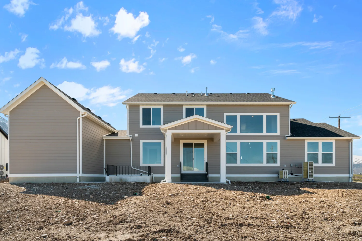 Contemporary two-story exterior with gray siding