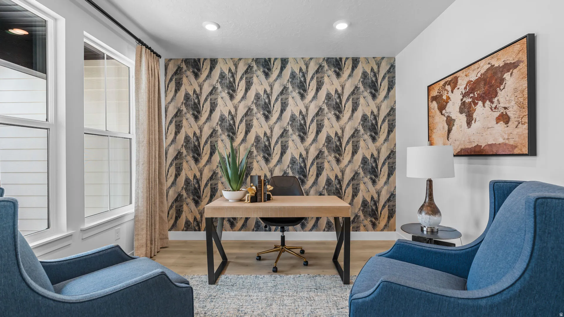 Accent wall with decorative wallpaper, recessed lighting, wood-finish flooring, and large windows with privacy blinds