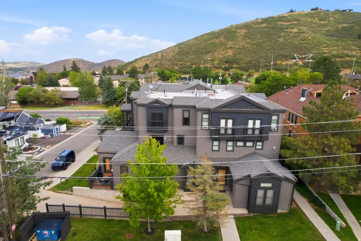 Contemporary multi-level residence with a gray and dark blue exterior