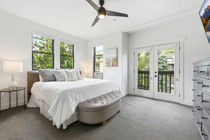 White walls with recessed lighting and a ceiling fan