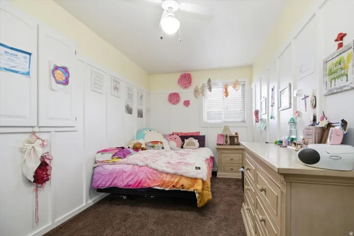White wall paneling with built-in cabinetry