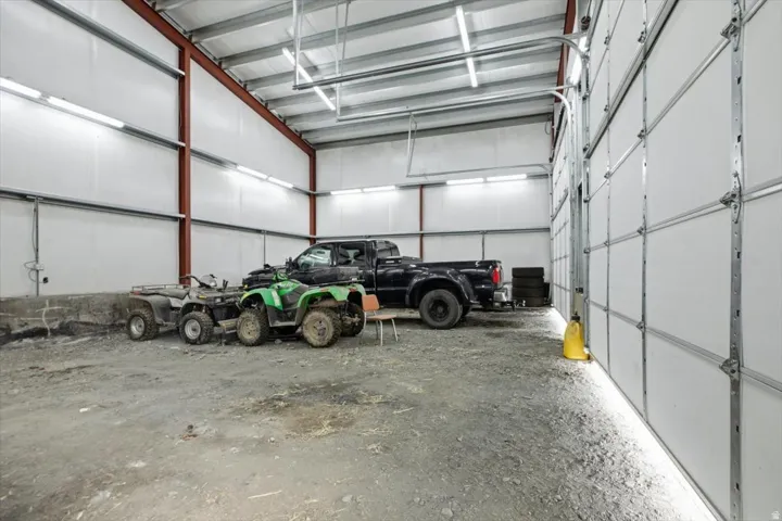 Spacious metal-framed garage with high ceilings and multiple overhead garage doors