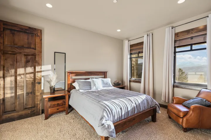 Middle Bedroom. Recessed lighting, wood-finish door, wood-finish window frames, and wall-to-wall carpeting