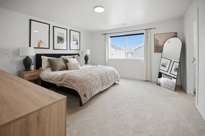 Plush carpeting, large window, and recessed lighting