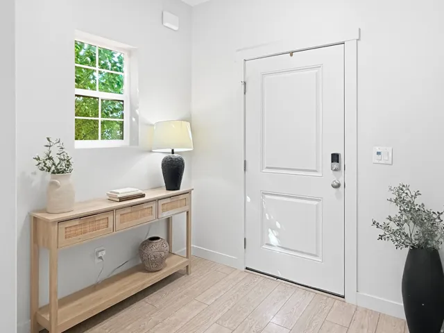 White paneled door with smart lock entry