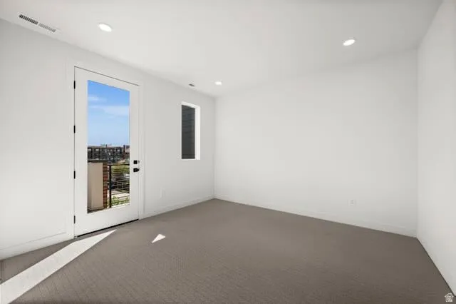 Primary bedroom with ensuite and walk-in closet. Door to south facing balcony