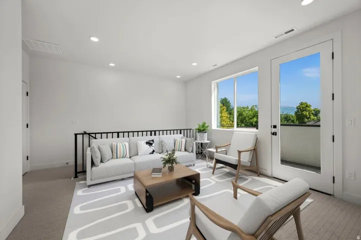Additional living area on the 3rd floor. Note: this photo has been modified to include virtual staging