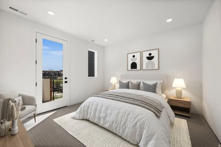 Primary bedroom on the 3rd floor. Note: this photo has been modified to include virtual staging