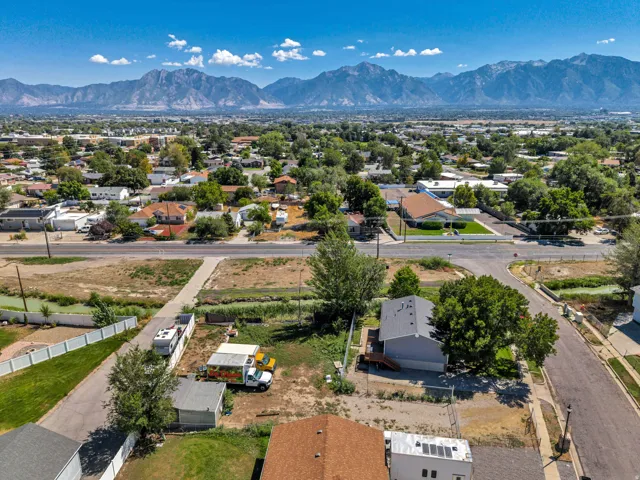 Expansive mountain range backdrop with a well-established neighborhood