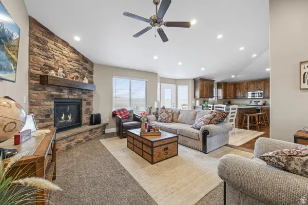 Large living room with gas burning log fireplace.