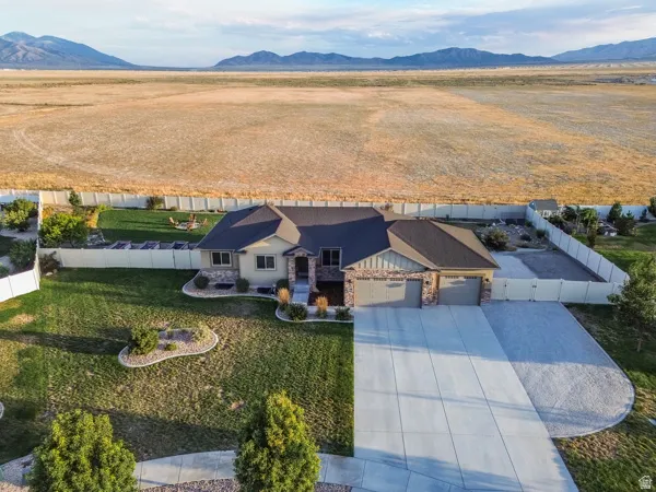 Fully fenced yard features a dual gate and man gate with front access and man gate out from the back yard.